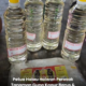 Botol plastik berisi campuran kapur barus dan minyak tanah digantung di kebun untuk menghalau haiwan liar dan serangga perosak tanaman.