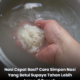 Nasi putih dalam periuk nasi dengan wap panas baru masak di dapur rumah yang bersih