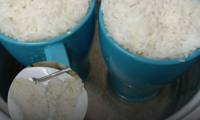 Beras setengah cawan yang telah dibasuh dimasukkan ke dalam cawan tahan panas sebelum dimasak.