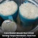 Beras setengah cawan yang telah dibasuh dimasukkan ke dalam cawan tahan panas sebelum dimasak.