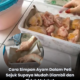 Ketulan ayam mentah disusun berlapis dalam bekas menggunakan kertas pembalut makanan sebagai pemisah sebelum disimpan dalam peti sejuk beku.